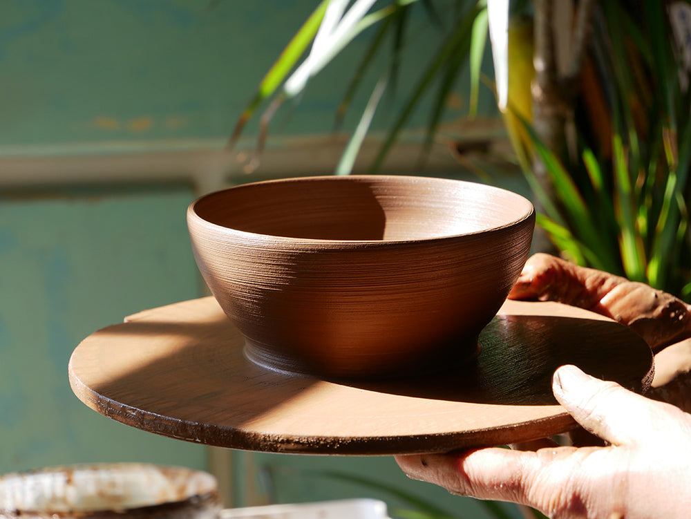 Freshly thrown pottery bowl