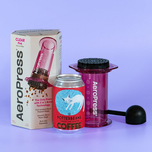 pink aeropress, clear high quality, with journal and fre coffee