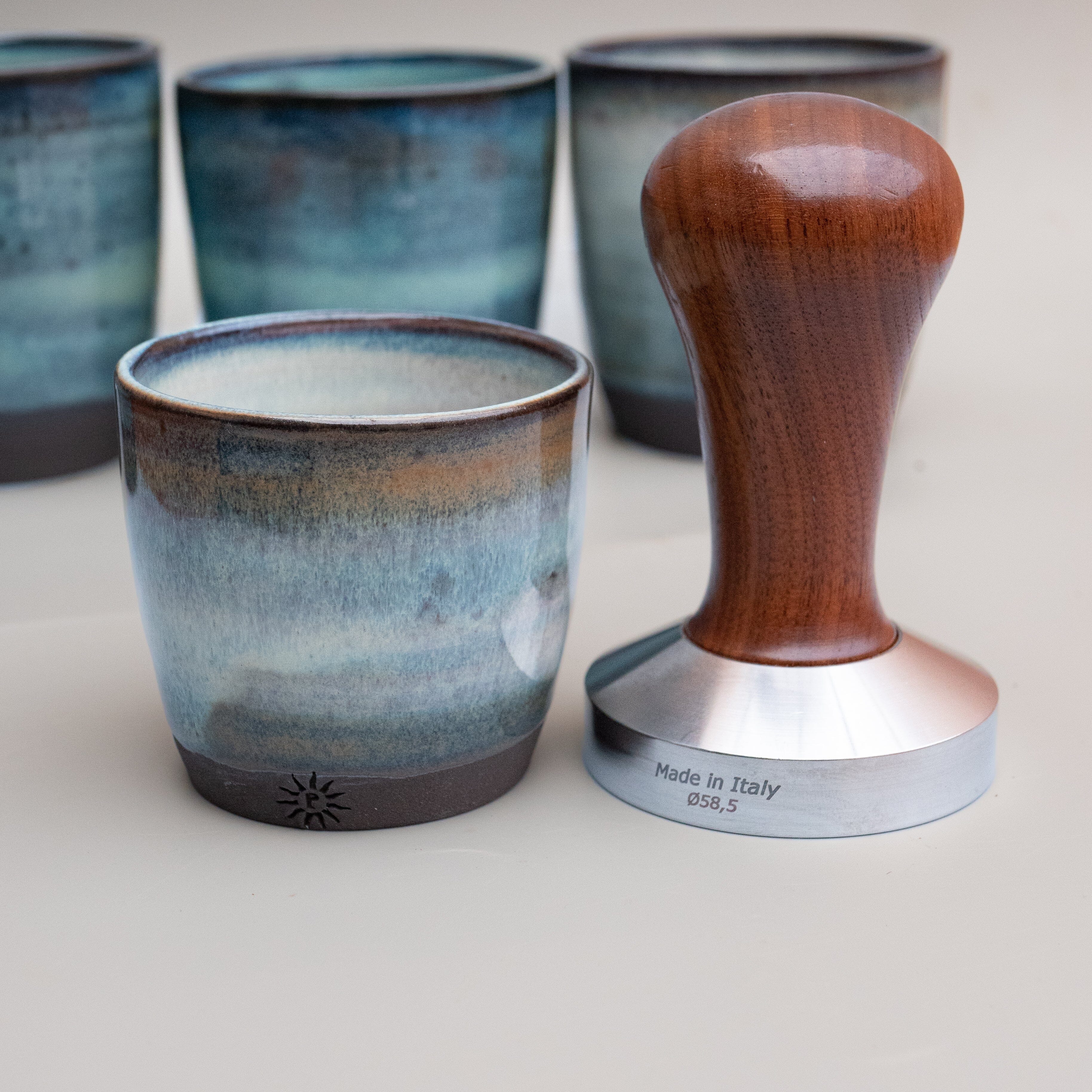 hand thrown espresso cups in a waters edge glaze, from our pottery studio