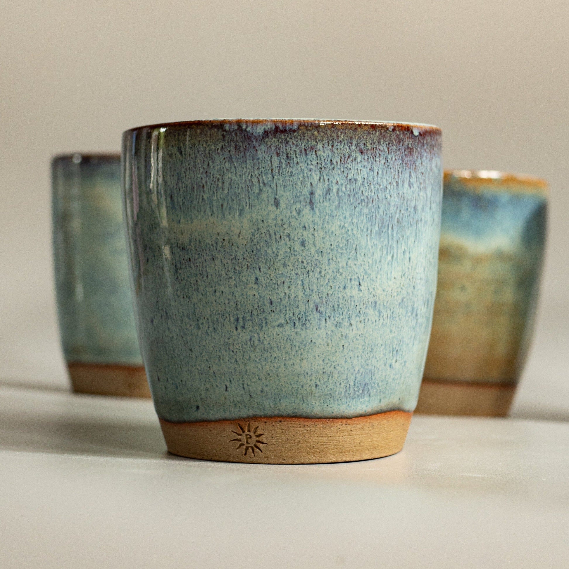 hand thrown pottery tumbler. Toasted stoneware clay.