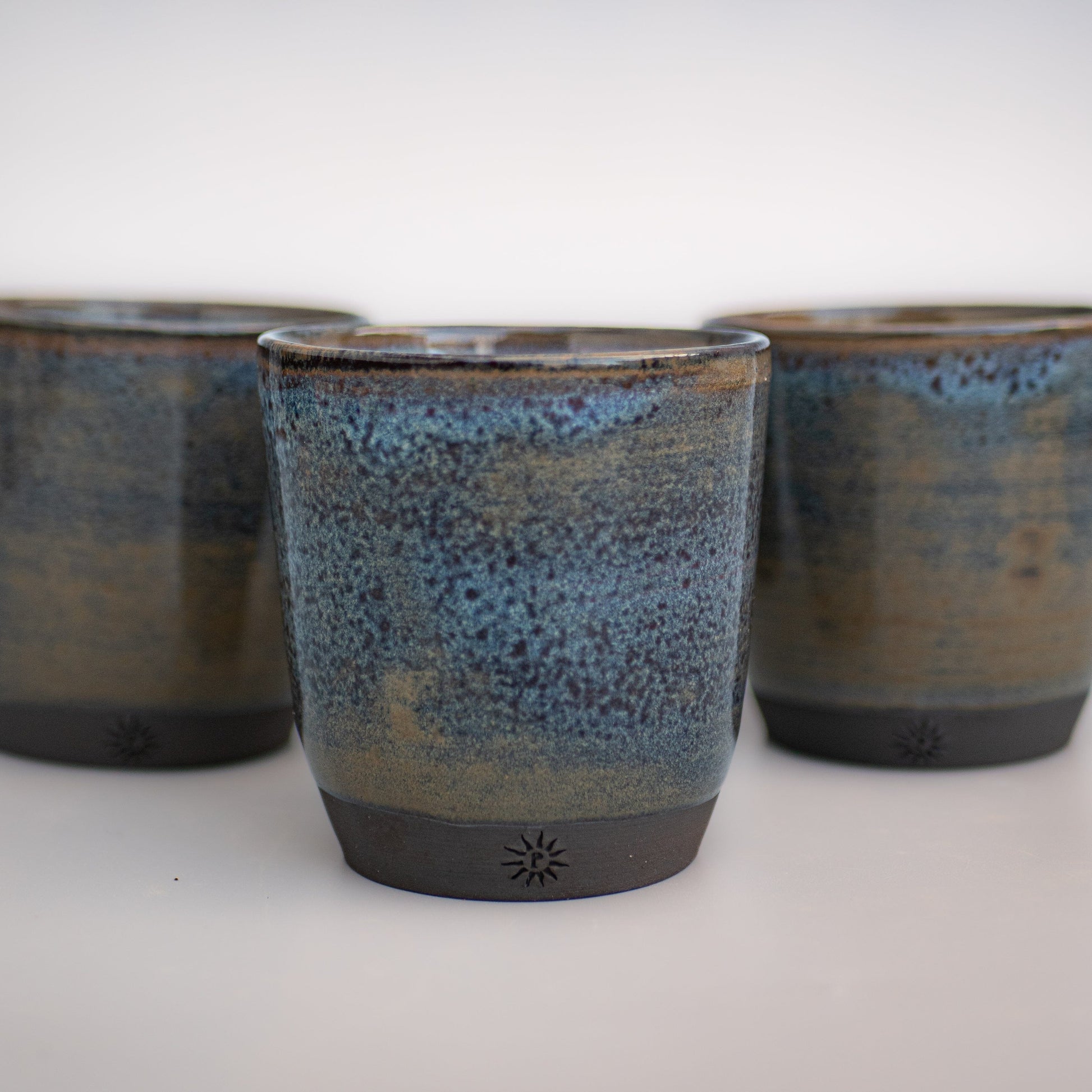 stoneware black clay tumbler wheel thrown. Night waters glaze