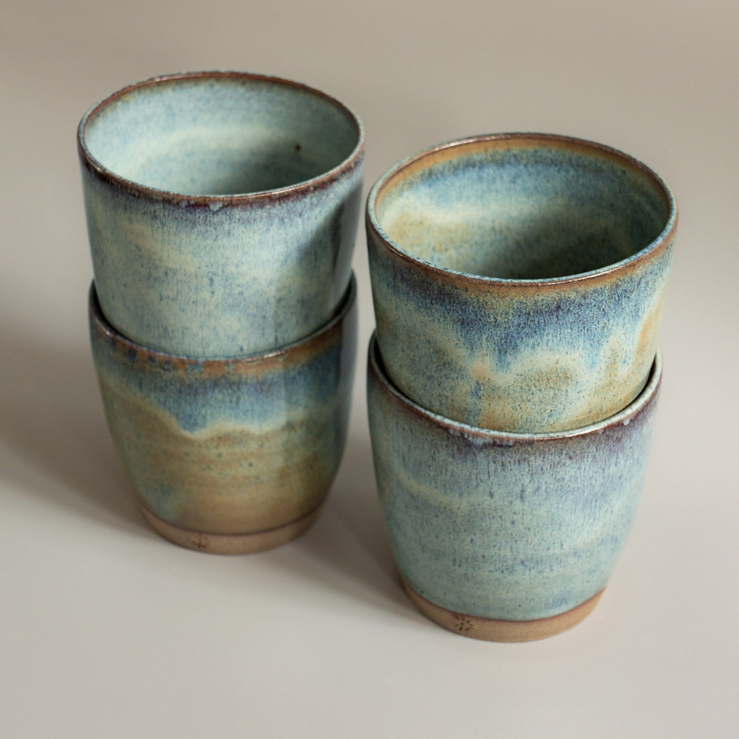 Tumbler thrown by hand in toasted stoneware clay.